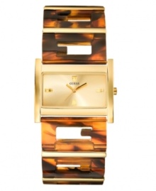 Chic tortoise logo links make up the bracelet of this iconic cuff bracelet watch by GUESS.