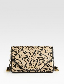 Animal printed haircalf trimmed in luxurious leather with a radiant chain strap.Chain and leather shoulder strap, 10 dropMagnetic flap closureProtective metal feetThree inner compartmentsOne inside zip pocketTwo inside open pocketsFully lined5½W X 9½H X 2DImported