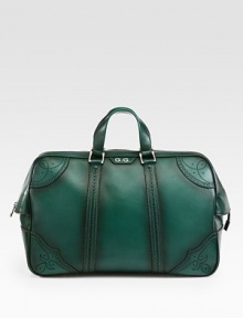 Green hand-stained leather duffel with perforated trim detail.Top zip closureLeather top handleInside pocket with a Gucci crest zipperFive metal feetVelvet Diamante liningLeather20.5W x 12.2H x 8DMade in Italy