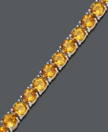 Add new light to your look with punch-bright color. Bracelet features a sunny row of round-cut citrine (17 ct. t.w.) set in smooth sterling silver. Approximate length: 7 inches.