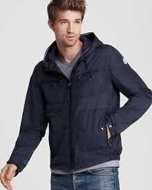 Lightweight but rigorously constructed, this handsome quilted jacket has you covered with an attached hood, gathered waist and snap wrists. Lightweight but rigorously constructed, this handsome quilted jacket has you covered with an attached hood, gathered waist and snap wrists.