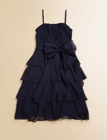 Tiers of dazzling ruffles and a simple sash tie take this classic A-line frock from elegant to extravagant.Sweetheart necklineAdjustable spaghetti strapsSide zipperBack smockingWaistband with ribbon tieFull, ruffled skirtPolyesterDry cleanImported of domestic fabric Tiers of dazzling ruffles and a simple sash tie take this classic A-line frock from elegant to extravagant.Sweetheart necklineAdjustable spaghetti strapsSide zipperBack smockingWaistband with ribbon tieFull, ruffled skirtPolyesterDry cleanImported of domestic fabric