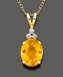 Oval-cut citrine( 2.2 ct. t.w.) crowned with diamond accents and mounted in polished 14k gold. Chain measures 18 inches. Oval-cut citrine( 2.2 ct. t.w.) crowned with diamond accents and mounted in polished 14k gold. Chain measures 18 inches.