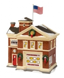 Covered in a light layer of snow, the Firehouse No. 5 features an old-fashioned brick facade with multi-colored windows and an iconic bright red door. A quaint addition to your small town setup boasts American patriotism and Christmas cheer wrapped in one.