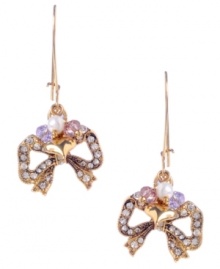 Add a little sweet shimmer to your look. Betsey Johnson's adorable bow earrings are decorated with round-cut clear crystals with small purple and pink cherry bead accents. Crafted in antique gold-plated mixed metal. Approximate drop: 1-3/4 inches.