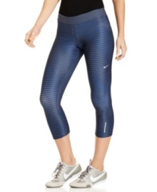 Reach the summit of style in these sleek striped capris from Nike! Its Dri-FIT technology will keep you cool and comfy during long hikes or tough workouts.