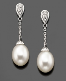 Swinging style you'll always love. These beautiful drop earrings feature cultured freshwater pearls (7.5-8 mm) and diamond accents set in 14k white gold. Approximate drop: 1-1/4 inches. Swinging style you'll always love. These beautiful drop earrings feature cultured freshwater pearls (7.5-8 mm) and diamond accents set in 14k white gold. Approximate drop: 1-1/4 inches.