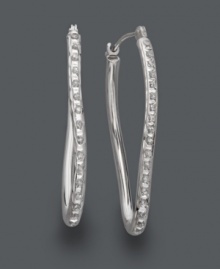 Add star-worthy style to your wardrobe. Sparkling hoops features a unique twisted design accented by round-cut diamonds. Crafted in 14k white gold. Approximate diameter: 1-1/4 inches. Add star-worthy style to your wardrobe. Sparkling hoops features a unique twisted design accented by round-cut diamonds. Crafted in 14k white gold. Approximate diameter: 1-1/4 inches.