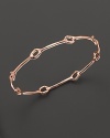 This slim bangle is punctuated by oval stations--the perfect bracelet for stacking.