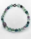A colorful strand of flourite beads accented with a amethyst encrusted bead. AmethystMulti-colored flouriteRhodium-plated sterling silverLength, about 18Spring ring closureImported 