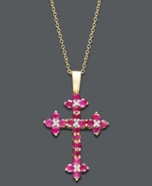 Boldly express your faith. This intricate cross pendant displays round-cut rubies (1-1/6 ct. t.w.) and sparkling diamond accents set in 14k gold. Approximate length: 18 inches. Approximate drop: 1-1/4 inches. Boldly express your faith. This intricate cross pendant displays round-cut rubies (1-1/6 ct. t.w.) and sparkling diamond accents set in 14k gold. Approximate length: 18 inches. Approximate drop: 1-1/4 inches.