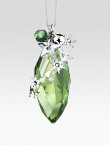 A graceful pinecone shape, in a soft green peridot color with light-catching facets and silvertone accents, including a tiny jingle bell.CrystalSilvertoneAbout 2.25H X .75WMade in Austria A graceful pinecone shape, in a soft green peridot color with light-catching facets and silvertone accents, including a tiny jingle bell.CrystalSilvertoneAbout 2.25H X .75WMade in Austria