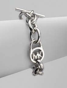 A sleek silvertone design with an iconic logo embellished lock on a chain link. Silvertone metalLength, about 8Toggle closureImported 