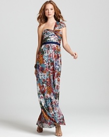 A fresh twist on evening wear, this BCBGMAXAZRIA one-shoulder gown flaunts a painterly floral print subtly accented by shimmering metallic.