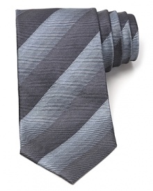 Thin tonal stripes dash across this handsome tie, rendered in luxurious Italian silk for classic opulence. Thin tonal stripes dash across this handsome tie, rendered in luxurious Italian silk for classic opulence.