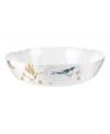 Abuzz with hummingbirds, the airy and bright Nectar serving bowl brings the outdoors in. Versatile bone china formed in Spode's impressions shapes with a crisp white glaze complements serene country settings.