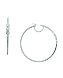 Subtle sparkle that catches the eye. These hoop earrings from Vince Camuto are embellished with shimmering crystal stones. Crafted in rhodium-plated mixed metal. Approximate diameter: 2-1/2 inch. Subtle sparkle that catches the eye. These hoop earrings from Vince Camuto are embellished with shimmering crystal stones. Crafted in rhodium-plated mixed metal. Approximate diameter: 2-1/2 inch.