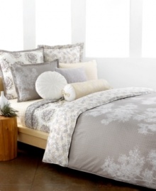 The Snow Willow duvet cover set captures the beauty of winter in neutral colors fit for all seasons. Scattered white branches grow across a muted, geometric design while the reverse presents a collection of these branches in calming color.