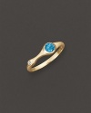 A faceted blue topaz and a brilliant diamond add bright color to gleaming 18K yellow gold. By Carelle.