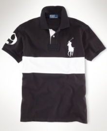 Channeling iconic, sporty style with bold pieced detailing, a handsome short-sleeved polo is cut for a comfortable fit from breathable cotton mesh. Channeling iconic, sporty style with bold pieced detailing, a handsome short-sleeved polo is cut for a comfortable fit from breathable cotton mesh.