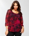 Sizzling-hot snakeskin print puts a new spin on INC's plus size peasant top. Sheer sleeves and jewel-toned colors give this silhouette a fresh look.