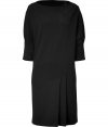 Elegant, structured dress in black synthetic fiber - Asymmetric cut with a slim, straight silhouette, high round neck and cuffed 3/4-length sleeves - Features decorative pleats - Simple, sophisticated dress is professional and stylish - Wear to the office or on a night out with favorite heels, booties or flats