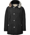 Stylish and sporty black down coat in a washable cotton blend from the American heritage label Woolrich - Tapers slightly at waist, hits at mid-thigh - Rabbit fur collar lends this coat a veritable feeling of warmth and luxe - Water and snow resistant, with multiple pockets and hood - Exceptionally warm, can be worn in temperatures as low as -30 F - A versatile, classic coat perfect for both city streets and country slopes