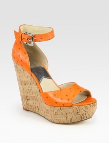 Rustic cork wedge topped with an ostrich-print leather upper and adjustable ankle strap. Cork wedge, 5 (125mm)Cork platform, 1½ (40mm)Compares to a 3½ heel (90mm)Ostrich-print leather upperLeather lining and solePadded insoleImported