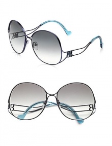 This curvy style boasts a thin, round shape with a unique, framed temple. Available in brown with brown gradient lens or blue with grey gradient lens. Logo temples100% UV protectionMade in Italy This curvy style boasts a thin, round shape with a unique, framed temple. Available in brown with brown gradient lens or blue with grey gradient lens. Logo temples100% UV protectionMade in Italy
