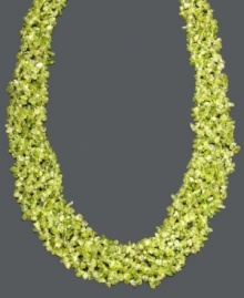 Add a layer of earthy green hues to your neckline. This vivid necklace features layers of peridot gemstone chips (4-6 mm) and a 14k gold toggle clasp. Approximate length: 20 inches. Add a layer of earthy green hues to your neckline. This vivid necklace features layers of peridot gemstone chips (4-6 mm) and a 14k gold toggle clasp. Approximate length: 20 inches.