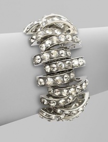 Bold, open arcs set with shimmering faceted Swarovski crystals.CrystalSilverplatedWidth, about 1Length, about 6½Hidden magnetic claspMade in Italy Bold, open arcs set with shimmering faceted Swarovski crystals.CrystalSilverplatedWidth, about 1Length, about 6½Hidden magnetic claspMade in Italy