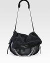 An edgy style in soft shearling accented with leather trim and shiny chain link accents.Adjustable leather and shearling shoulder strap, 12-21½ dropFlap closureOne zip pocket on flapOne inside zip pocket17W X 9H X 4DMade in Italy