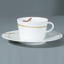 For over two centuries Raynaud has created unique Limoges porcelain, with a marked preference for relief shapes and generously colored and gilt decorations. Metamorphoses is a striking pattern of red and gold with a butterfly motif. For over two centuries Raynaud has created unique Limoges porcelain, with a marked preference for relief shapes and generously colored and gilt decorations. Metamorphoses is a striking pattern of red and gold with a butterfly motif.