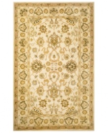 Drawing inspiration from the sandy ruins of ancient Petra and the traditional designs of India, this elegant, hand-tufted rug presents a rich decorative history set against a subtle ivory backdrop and accented with multiple gold and green tones. Drawing inspiration from the sandy ruins of ancient Petra and the traditional designs of India, this elegant, hand-tufted rug presents a rich decorative history set against a subtle ivory backdrop and accented with multiple gold and green tones.
