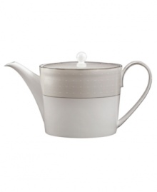 Set a dazzling tea or coffee service with this fine china teapot. From innovative designer Monique Lhullier, it features a pearlescent border with glossy raised dots and a fine stitch-like pattern. Set a dazzling tea or coffee service with this fine china teapot. From innovative designer Monique Lhullier, it features a pearlescent border with glossy raised dots and a fine stitch-like pattern.