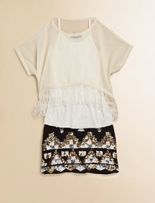 Light-as-air chiffon is layered and adorned with flirty fringe for a flapper-inspired ensemble.ScoopneckShort sleevesPullover stylingFringe hemPolyesterHand wash coldImported
