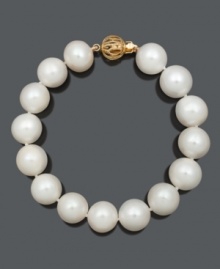 Refine your look with simple and sophisticated pearls. Bracelet features A+ cultured freshwater pearls (11-13 mm) with an ornate 14k gold circular clasp. Approximate length: 7-1/2 inches. Refine your look with simple and sophisticated pearls. Bracelet features A+ cultured freshwater pearls (11-13 mm) with an ornate 14k gold circular clasp. Approximate length: 7-1/2 inches.