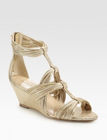 Fringe-like metallic leather straps, concluded with a self-covered wedge and an exposed back zipper. Self-covered wedge, 2½ (65mm)Metallic leather upperLeather lining and solePadded insoleImportedOUR FIT MODEL RECOMMENDS ordering true size. 