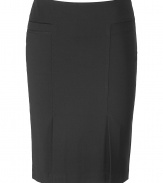 Luxurious skirt in black stretch rayon - genius mix of cool, sexy and classic, small delicate details turn this skirt into something special - broad waistband, accentuating seams - typical pencil skirt, figure hugging and slimming - two small box pleats for a flirty and comfortable effect - classic knee length - basic skirt, versatile to combine - pair with a blouse and pumps, a tunic and sandals or a jeans jacket and gladiator booties