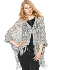 A relaxed poncho-style shape and fringe trim makes this Kensie sweater perfect for a summer boho look! A relaxed poncho-style shape and fringe trim makes this Kensie sweater perfect for a summer boho look!