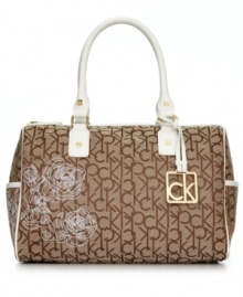 From deskside to dinner date, this classic silhouette from Calvin Klein will take you there in style. Signature jacquard fabric is punctuated with subtle golden hardware and contrasting leather trim, while feminine floral design detailing adds extra allure. From deskside to dinner date, this classic silhouette from Calvin Klein will take you there in style. Signature jacquard fabric is punctuated with subtle golden hardware and contrasting leather trim, while feminine floral design detailing adds extra allure.
