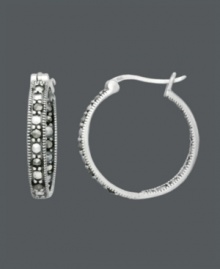 Sparkle that shines from the inside out. A stylish spin on the traditional hoop, Genevieve & Grace design features glittering marcasite in sterling silver. Approximate diameter: 7/8 inch. Sparkle that shines from the inside out. A stylish spin on the traditional hoop, Genevieve & Grace design features glittering marcasite in sterling silver. Approximate diameter: 7/8 inch.
