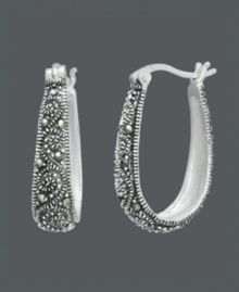 Free-spirited style with bohemian savvy. Genevieve & Grace hoop earrings feature glittering marcasite scrolls set in sterling silver. Approximate diameter: 15/16 inch. Free-spirited style with bohemian savvy. Genevieve & Grace hoop earrings feature glittering marcasite scrolls set in sterling silver. Approximate diameter: 15/16 inch.