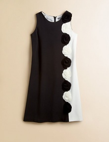 A sleeveless shift dress gets a groovy update in a 60's-inspired, colorblocked design and knit flowers.Round necklineSleevelessBack zipper63% polyester/32% rayon/5% spandexDry cleanImported