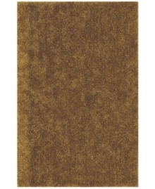 Add rich, shimmering gold texture to any modern room with the Metallic area rug from Dalyn. Hand-tufted of soft polyester, this high-luster shag area rug puts comfort and fun back in floor decor. Add rich, shimmering gold texture to any modern room with the Metallic area rug from Dalyn. Hand-tufted of soft polyester, this high-luster shag area rug puts comfort and fun back in floor decor.