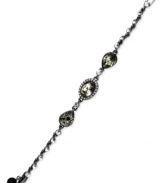 Subtle chic. Givenchy's flex bracelet is crafted from hematite-tone mixed metal with glass stones and cubic zirconia accents adding an elegant touch. Approximate length: 7-1/4 inches.