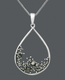 Like sand in an hourglass, this exquisite Genevieve & Grace pendant features a scattered array of marcasite in a smooth, sterling silver setting. Approximate length: 18 inches. Approximate drop: 1-3/8 inches. Like sand in an hourglass, this exquisite Genevieve & Grace pendant features a scattered array of marcasite in a smooth, sterling silver setting. Approximate length: 18 inches. Approximate drop: 1-3/8 inches.