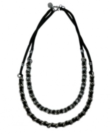 Life on the edge: let your look say it all. Vince Camuto's rock-inspired two-row necklace channels plenty of attitude with woven leather accents in a hematite tone mixed metal chain setting. Approximate length: 20 inches. Life on the edge: let your look say it all. Vince Camuto's rock-inspired two-row necklace channels plenty of attitude with woven leather accents in a hematite tone mixed metal chain setting. Approximate length: 20 inches.