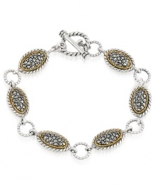 A shapely mix of sparkle and shine. Genevieve & Grace's trendy toggle bracelet features oval-shaped links crafted from sterling silver and 18k gold over sterling silver with glittering marcasite accents. Approximate length: 7-1/2 inches. A shapely mix of sparkle and shine. Genevieve & Grace's trendy toggle bracelet features oval-shaped links crafted from sterling silver and 18k gold over sterling silver with glittering marcasite accents. Approximate length: 7-1/2 inches.