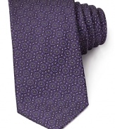Show your affection for modern luxury with this exquisite medallion print tie. Each circle surrounds a band of eight tiny hearts on lavish Italian silk. From Canali.